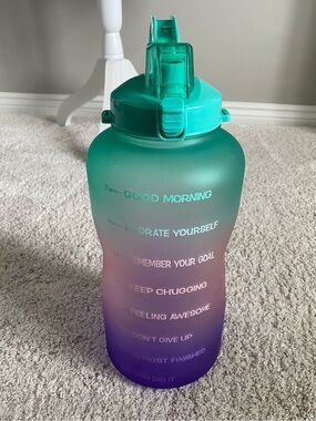 128 oz motivational water bottle with a green and purple gradient finish